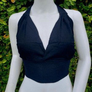 A mannequin wearing a black halter top.