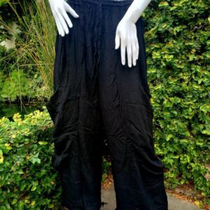 Black wide-leg harem pants on mannequin