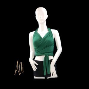 A mannequin wearing green top and black shorts.